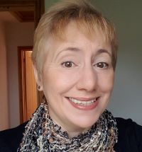 Selfie of Laura smiling and looking friendly.