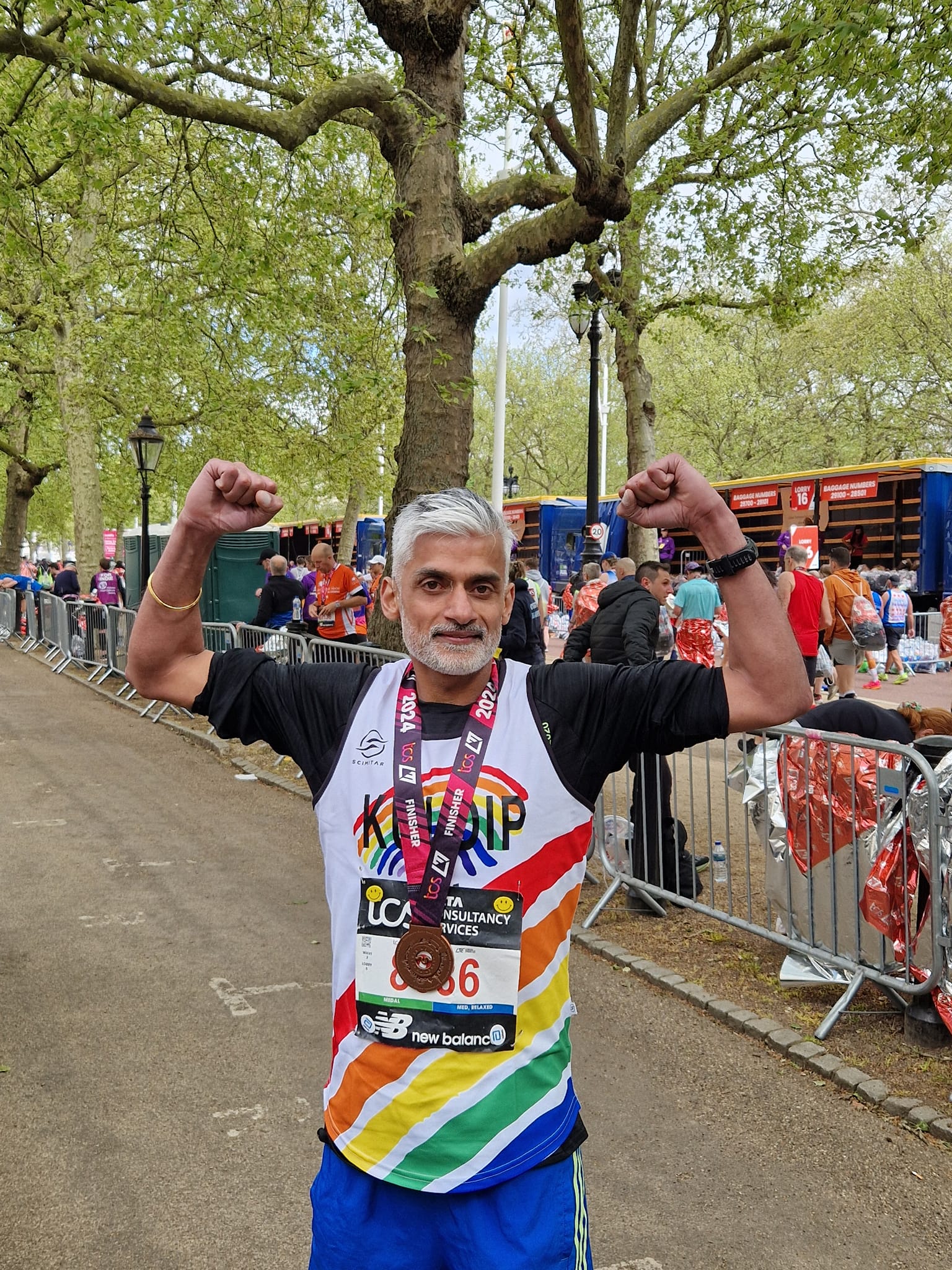 Returning Runner Kuldip 4 Holding her Tokyo marathon medal