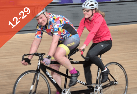 12 to 29. An image of a man and a girl cycling around a velodrome on a tandem bike.