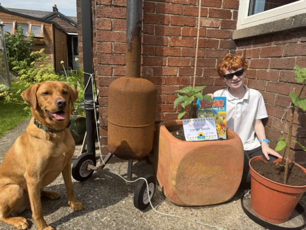 Luke-comic-book Luke, his sunflower and a Beano comic. His dog sits proudly nearby for the photo.
