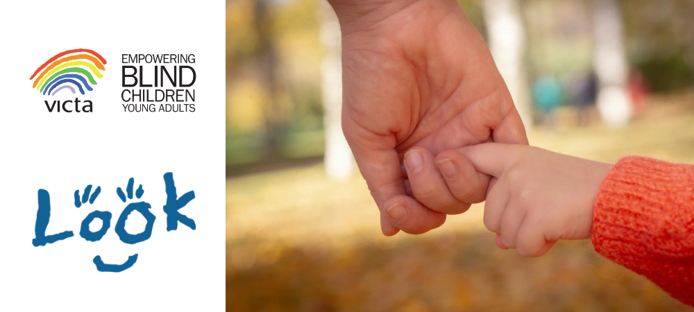 A child holding a parent's hand with the VICTA and LOOK logos on the left.
