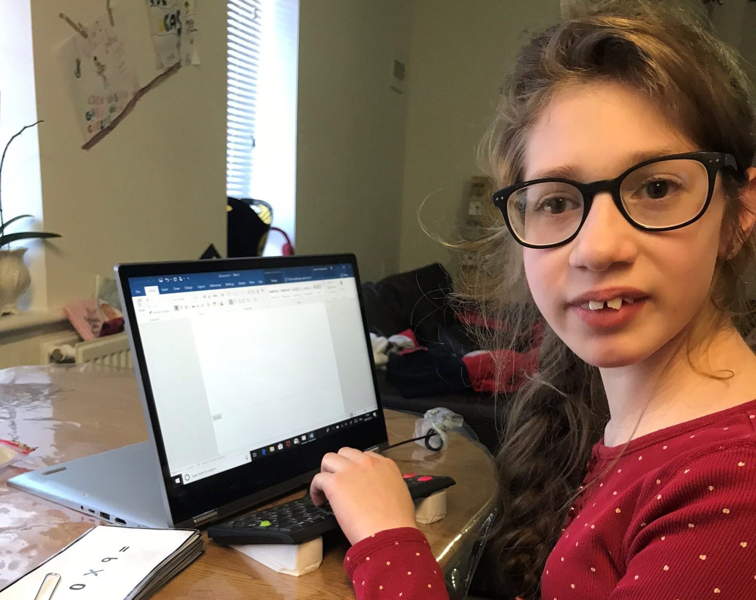 gabi-grant-laptop-thank-you Teenager sits with her VICTA assigned laptop