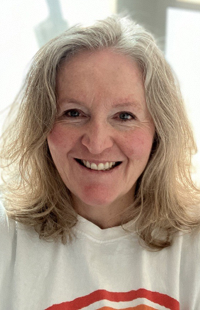 ronel A close up of Ronel in her white VICTA t-shirt smiling to the camera