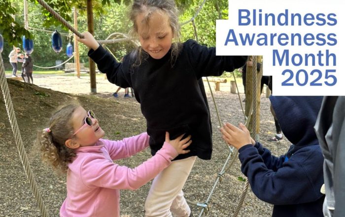 vision impaired children support each other on low ropes - Blindness Awareness Month 2025