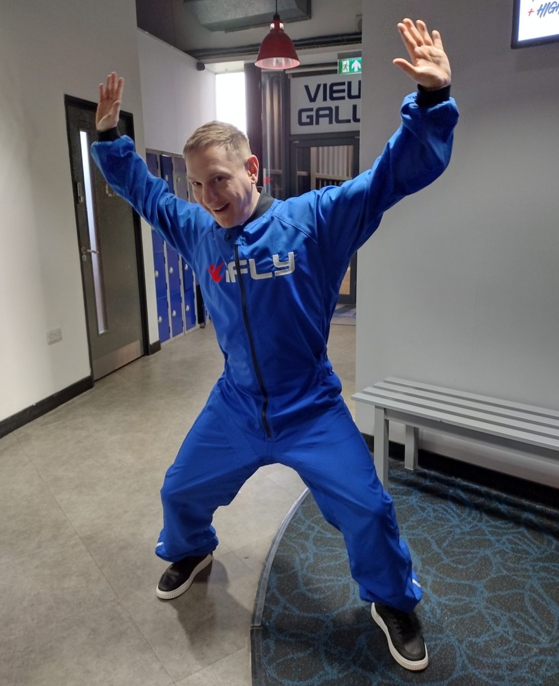 1000004991 Danny doing a star shape in excitement in his onesie