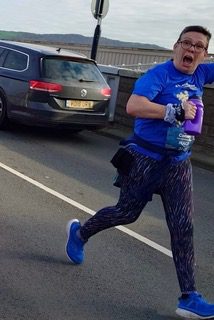 Mags out running. They pull a funny face to the camera.