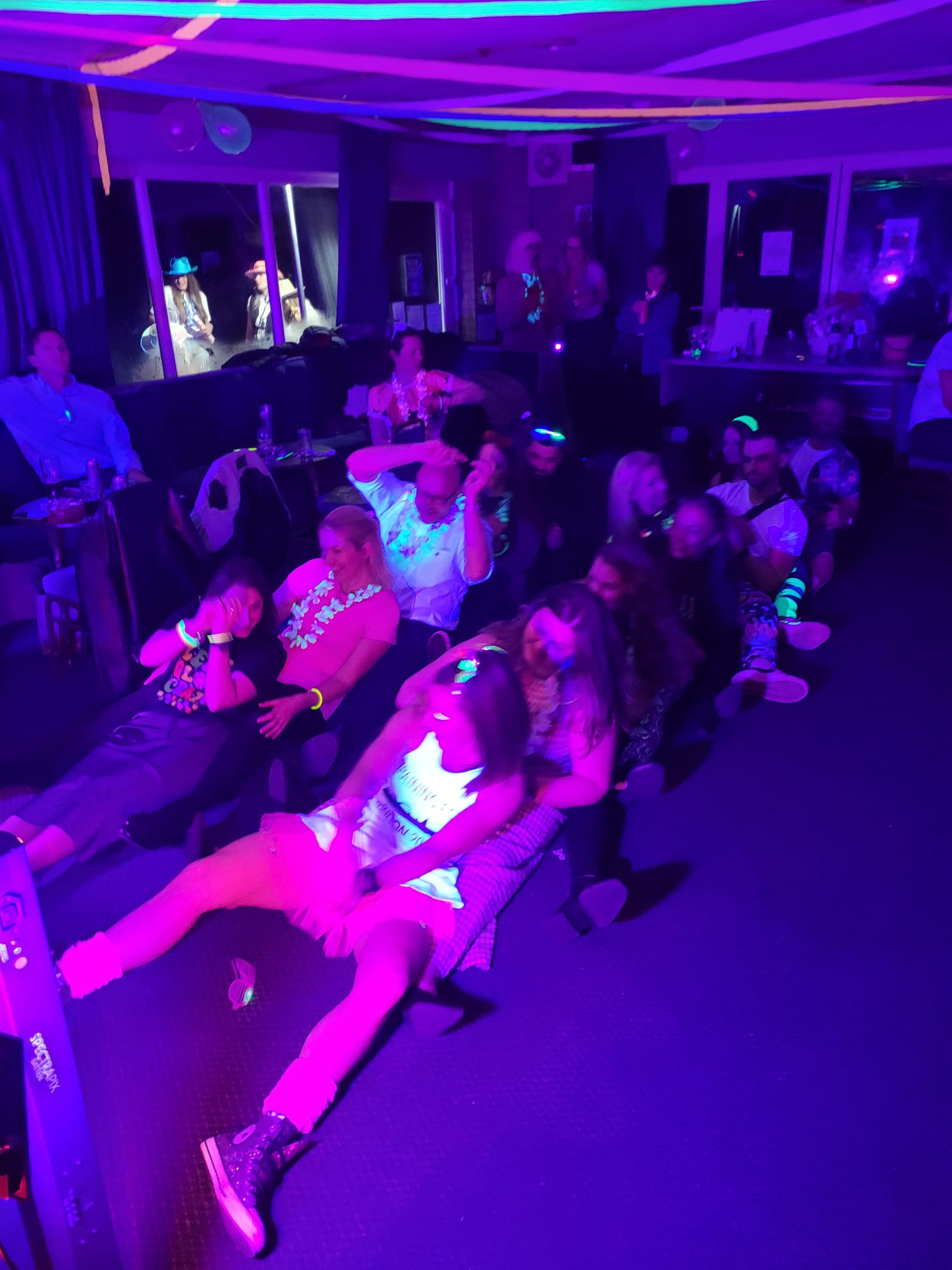 Everyone sits on the floors at the party doing the Oops upside your head boat dance move