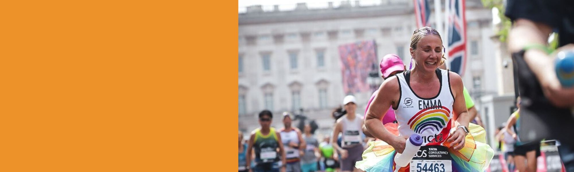 A runner cheers on the Mall at the London Marathon