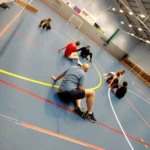 Trying goalball in the sports hall